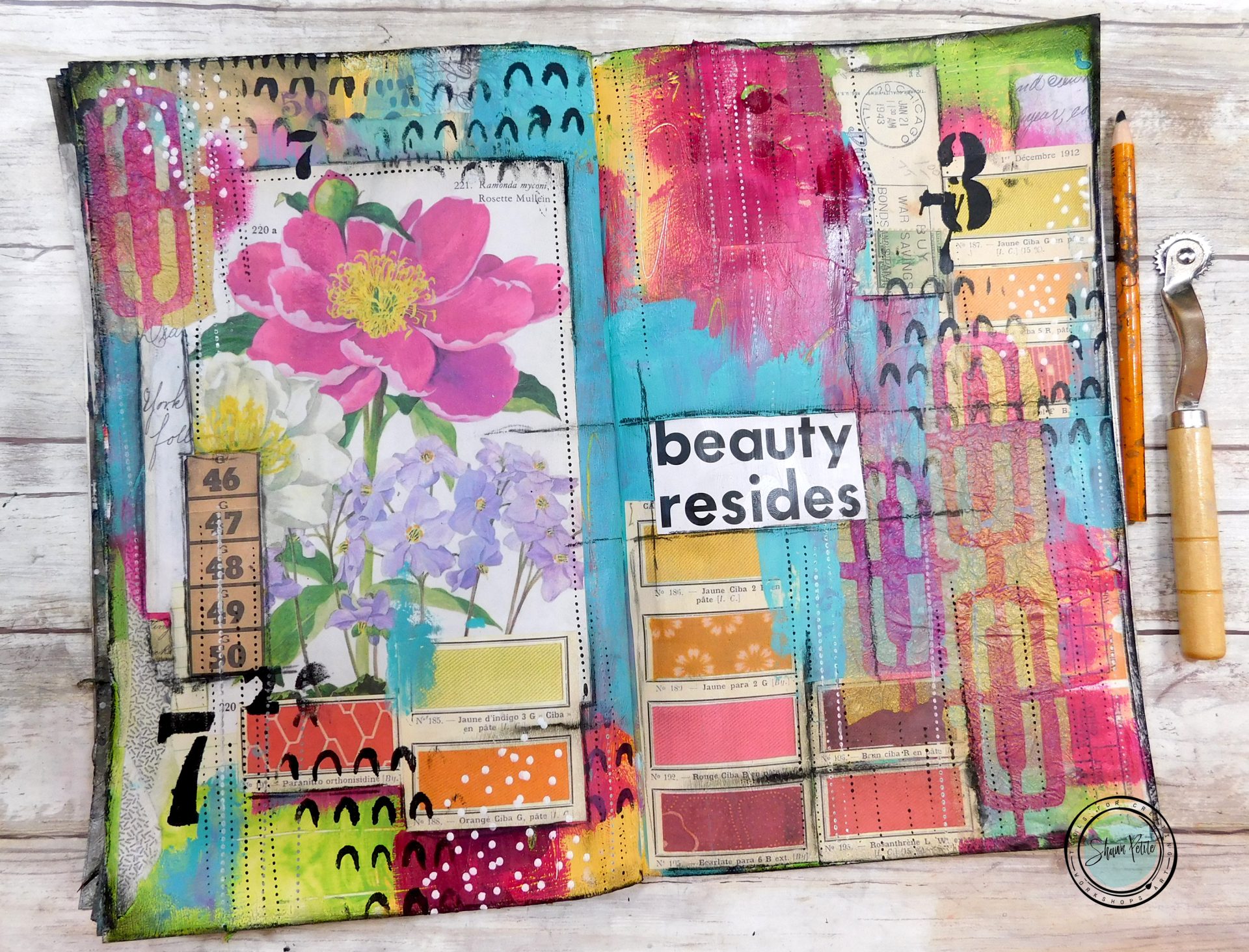 Mixed media journal page with artist tools
