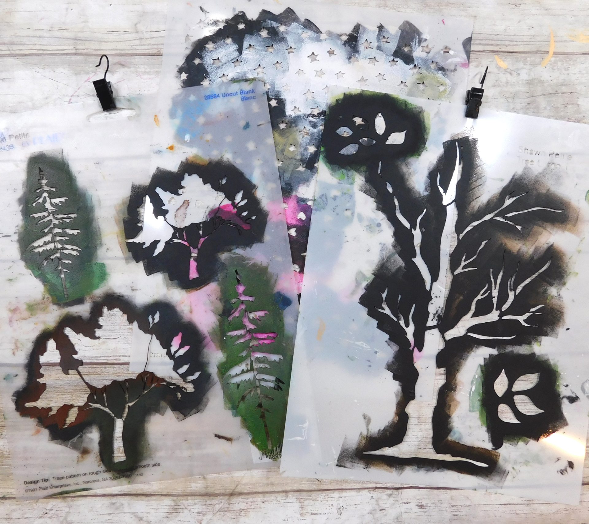 Stencils used in mixed media landscape